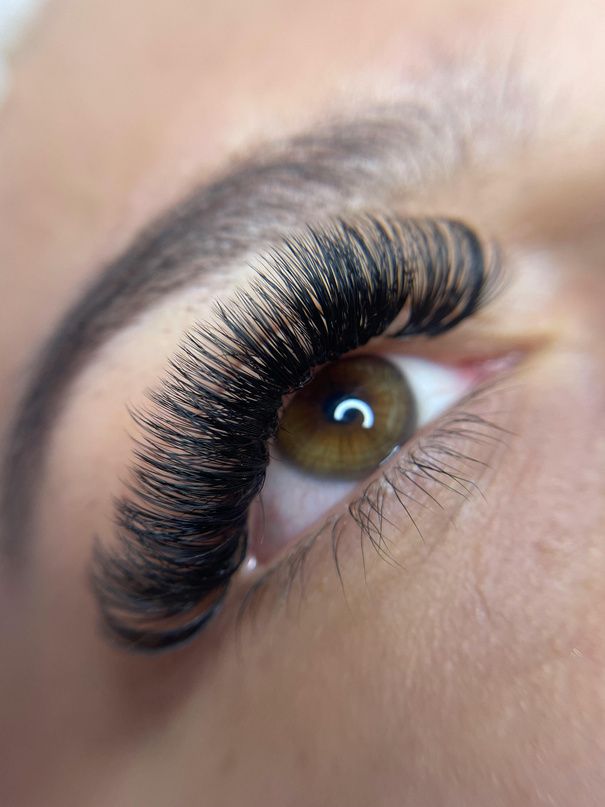 A woman's eye with long lashes and long eyelashes